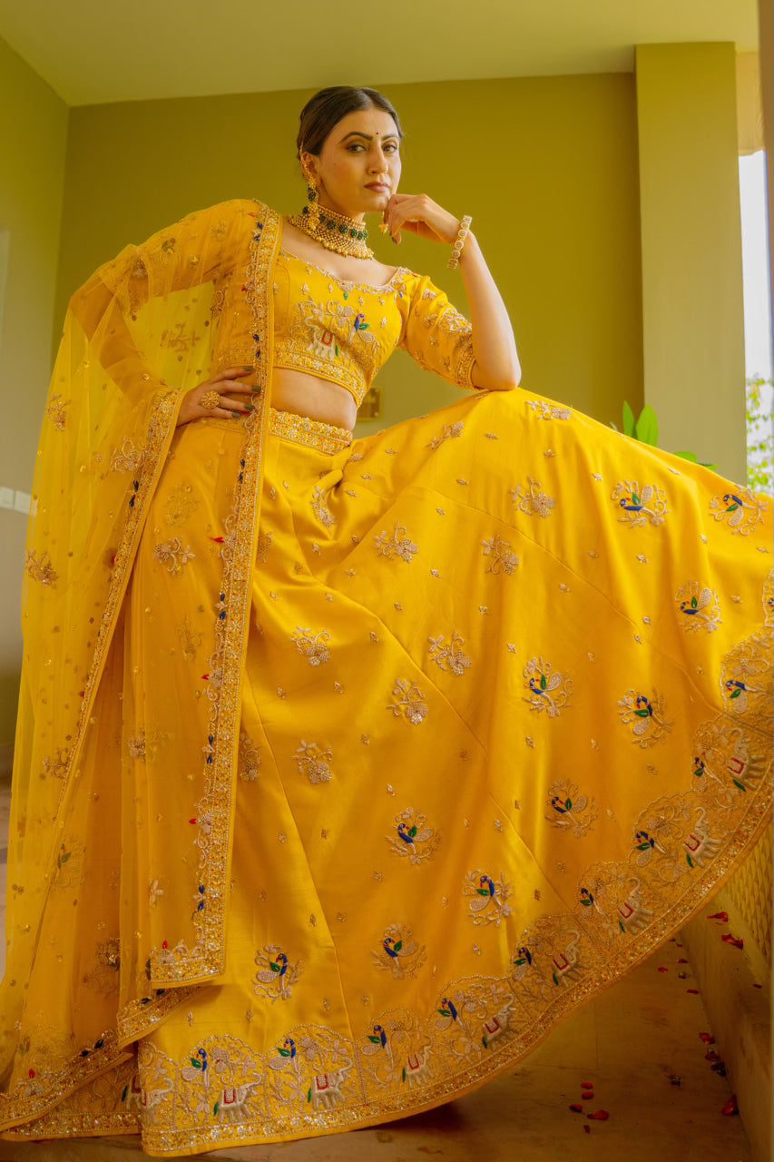 Yellow Raw Silk Lehenga with Zardozi Sequins Thread Peacock Elephant Motif Work