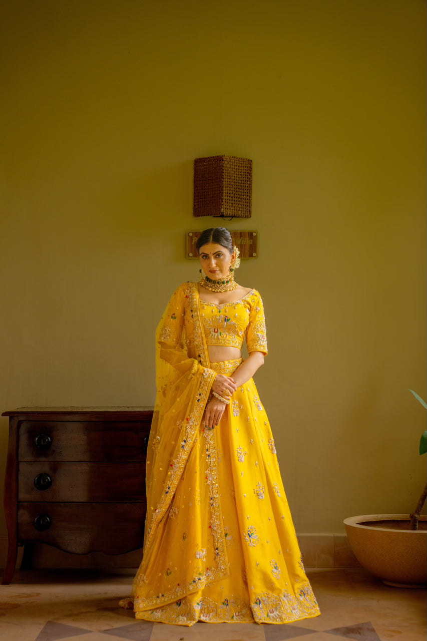 Yellow Raw Silk Lehenga with Zardozi Sequins Thread Peacock Elephant Motif Work