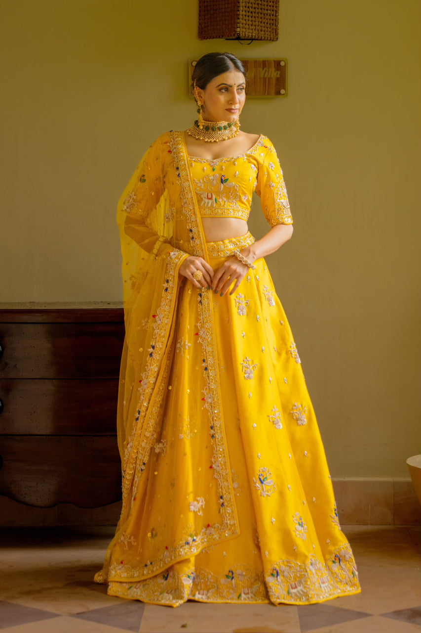 Yellow Raw Silk Lehenga with Zardozi Sequins Thread Peacock Elephant Motif Work