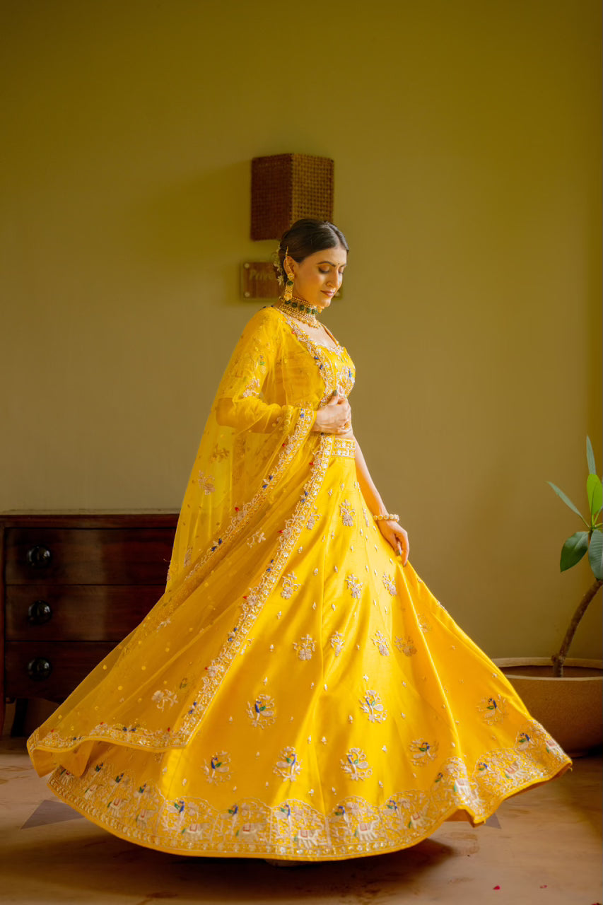 Yellow Raw Silk Lehenga with Zardozi Sequins Thread Peacock Elephant Motif Work