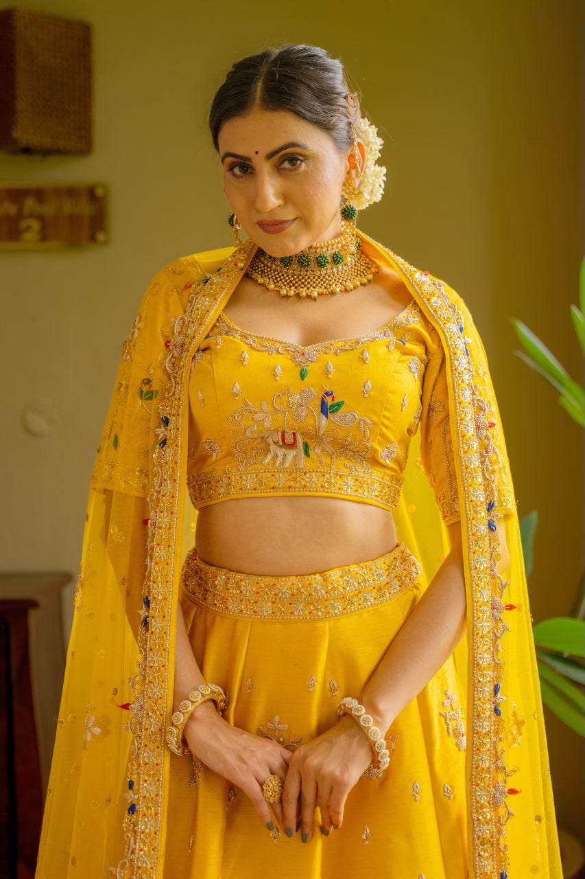 Yellow Raw Silk Lehenga with Zardozi Sequins Thread Peacock Elephant Motif Work