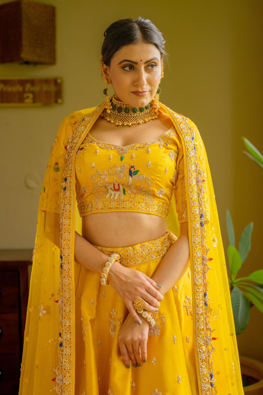 Yellow Raw Silk Lehenga with Zardozi Sequins Thread Peacock Elephant Motif Work