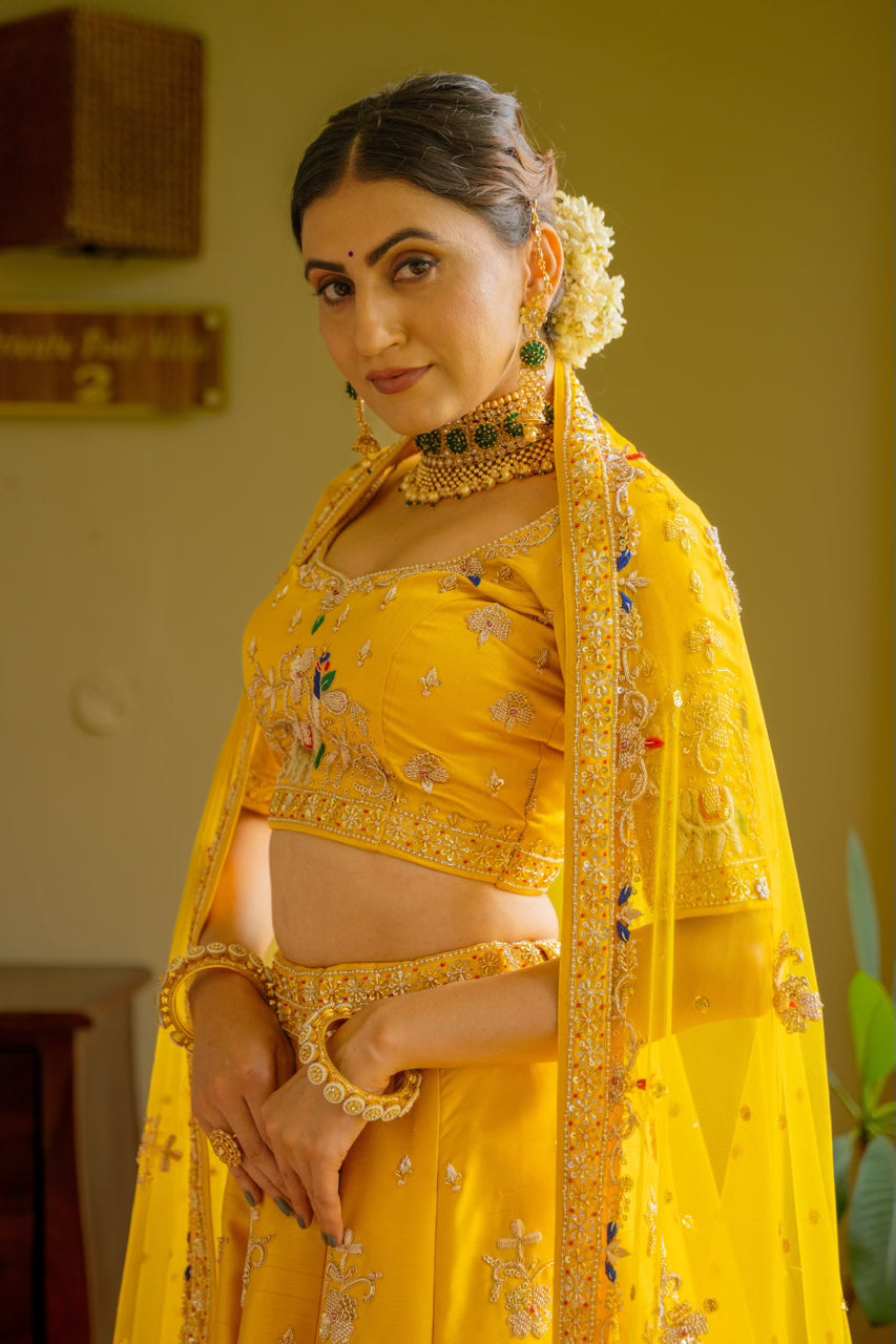 Yellow Raw Silk Lehenga with Zardozi Sequins Thread Peacock Elephant Motif Work