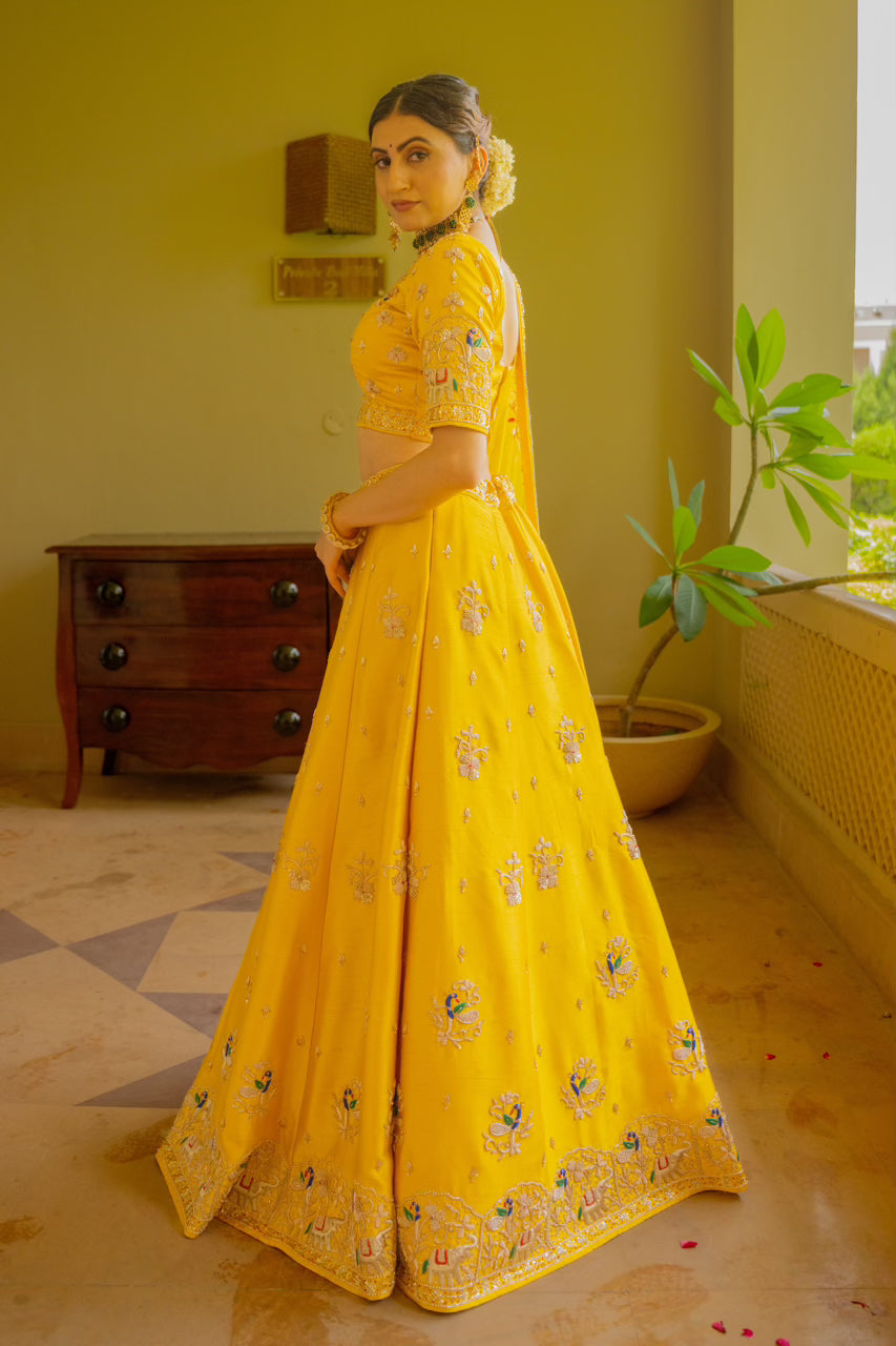 Yellow Raw Silk Lehenga with Zardozi Sequins Thread Peacock Elephant Motif Work