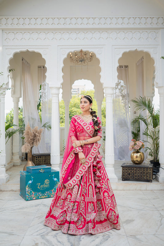 A stunning hot pink silk bridal lehenga featuring peacock motifs aari sequins zardozi work lehenga beautifully adorned with fine craftsmanship and exquisite detailing, perfect for festive and special occasions.