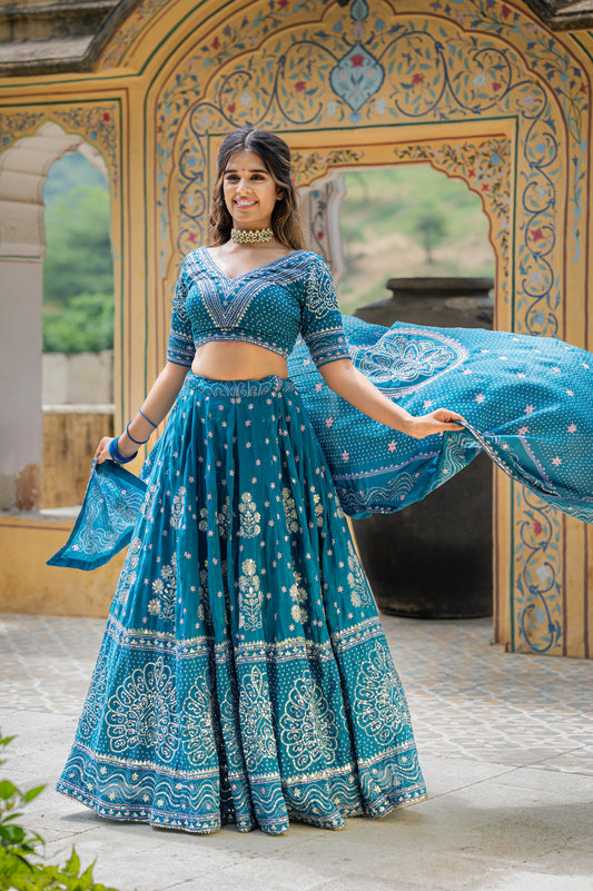 A stunning eastern blue silk bandhej lehenga featuring marodi and gota patti work lehenga beautifully adorned with fine craftsmanship and exquisite detailing, perfect for festive and special occasions.
