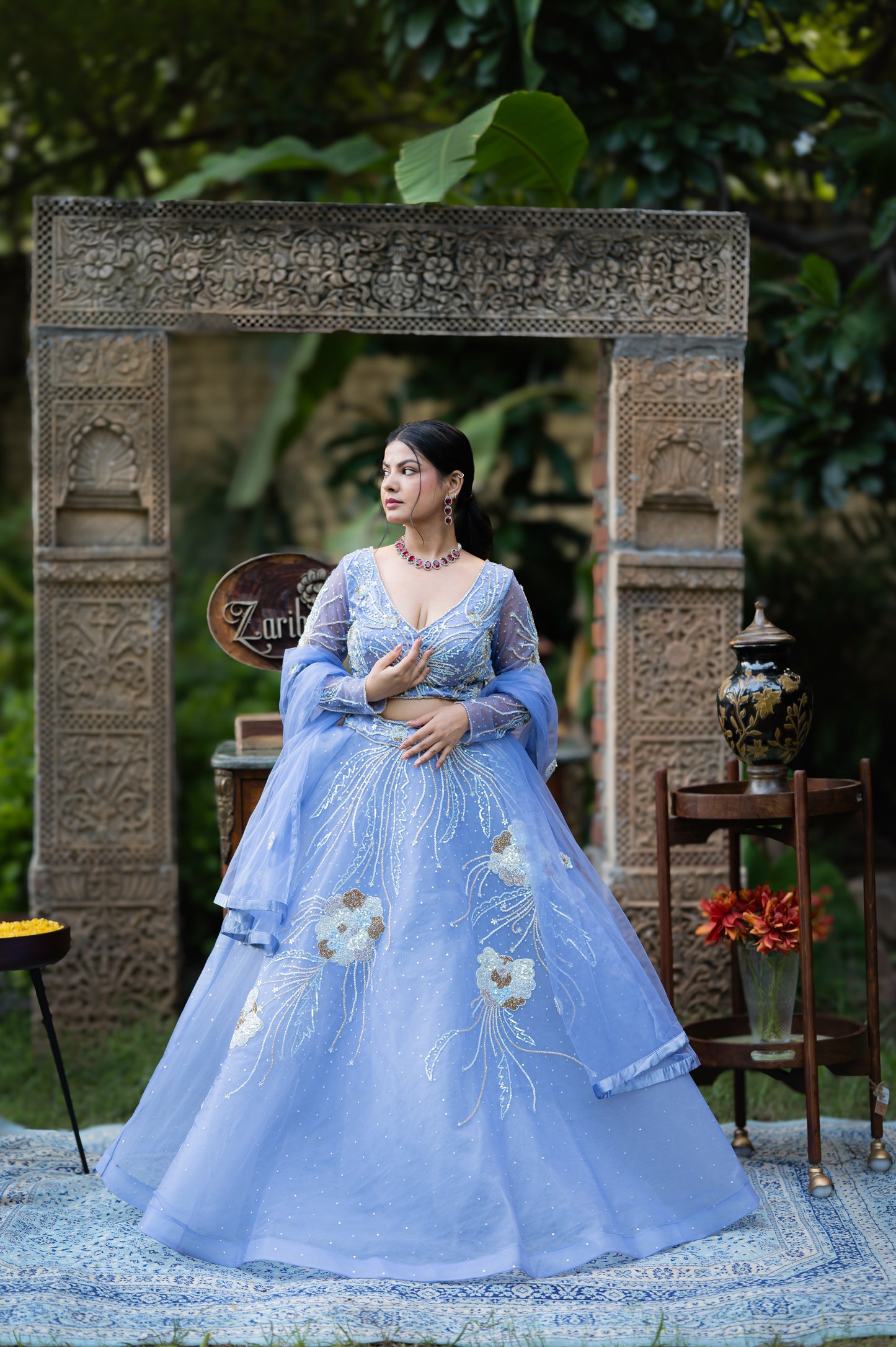 A stunning dark pastel blue net lehenga featuring kardana sequins work lehenga beautifully adorned with fine craftsmanship and exquisite detailing, perfect for festive and special occasions.