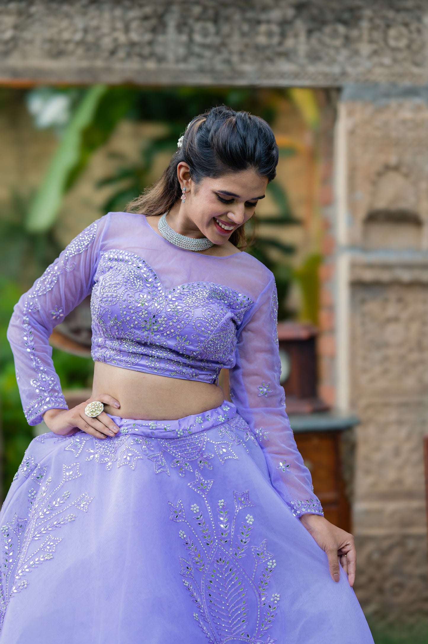 A stunning blue haze net lehenga featuring thread and mirror work lehenga beautifully adorned with fine craftsmanship and exquisite detailing, perfect for festive and special occasions.