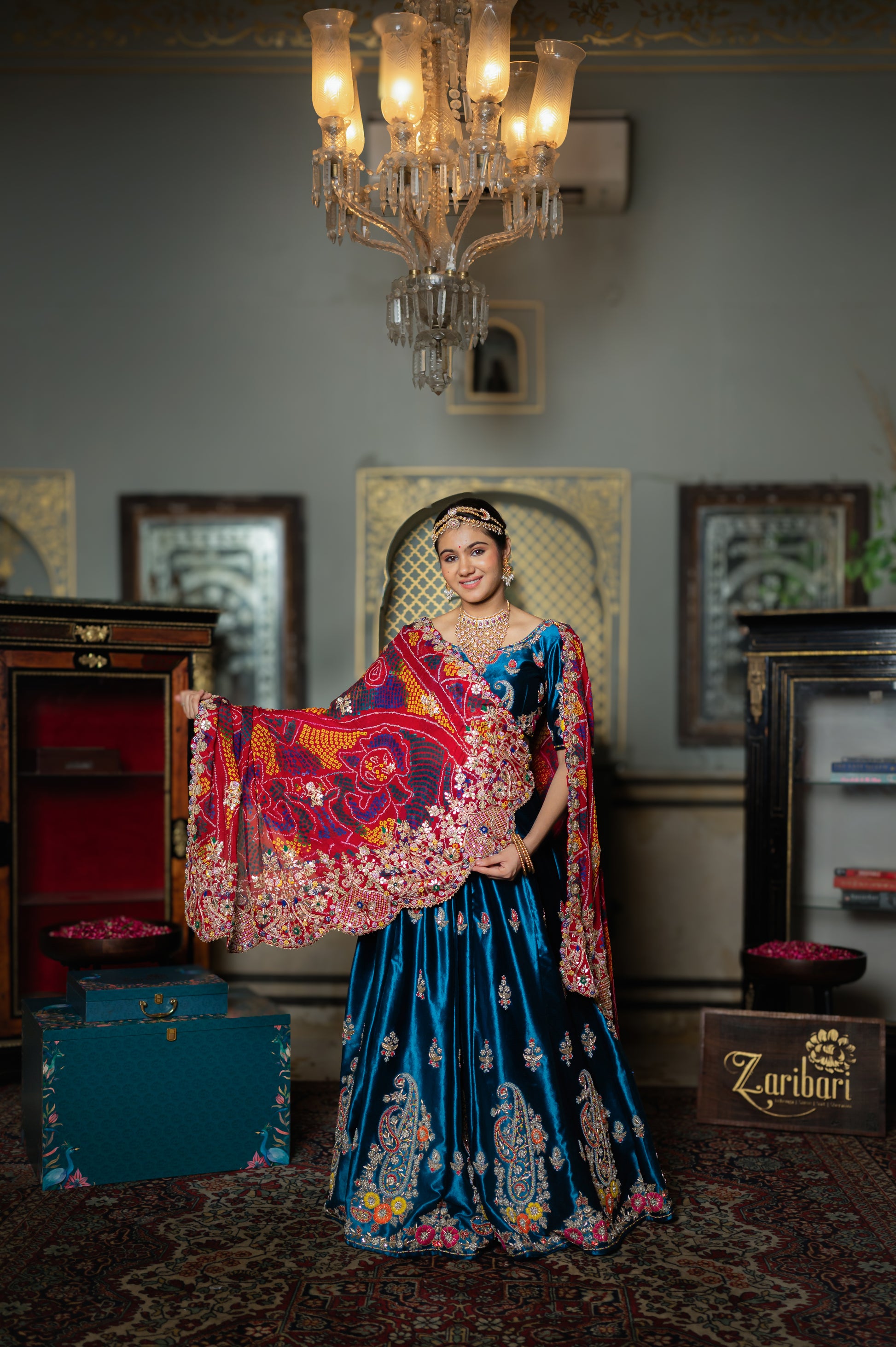 A stunning red pure ojariya bandhej chunari featuring marodi zardozi sequins gota patti work chunari beautifully adorned with fine craftsmanship and exquisite detailing, perfect for festive and special occasions.