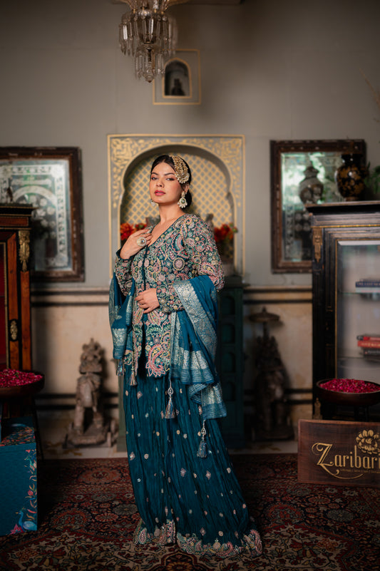 A stunning prussian blue sharara set featuring thread sequins and moti work set beautifully adorned with fine craftsmanship and exquisite detailing, perfect for festive and special occasions.