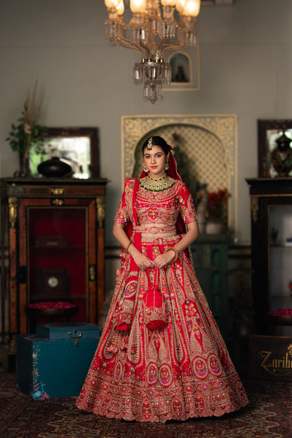A stunning red raw silk bridal lehenga featuring embroidery aari sequins work lehenga beautifully adorned with fine craftsmanship and exquisite detailing, perfect for festive and special occasions.