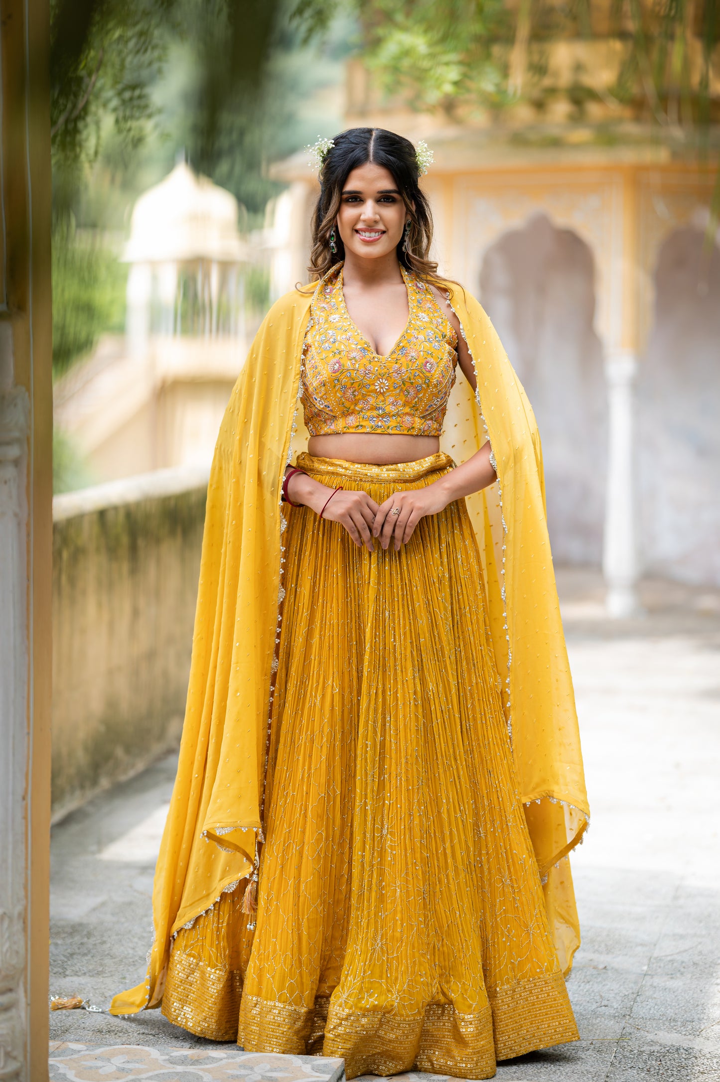 A stunning satin sheen gold chinon lehenga featuring aari sequins work lehenga beautifully adorned with fine craftsmanship and exquisite detailing, perfect for festive and special occasions.