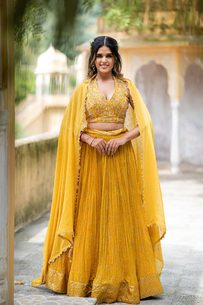 A stunning satin sheen gold chinon lehenga featuring aari sequins work lehenga beautifully adorned with fine craftsmanship and exquisite detailing, perfect for festive and special occasions.