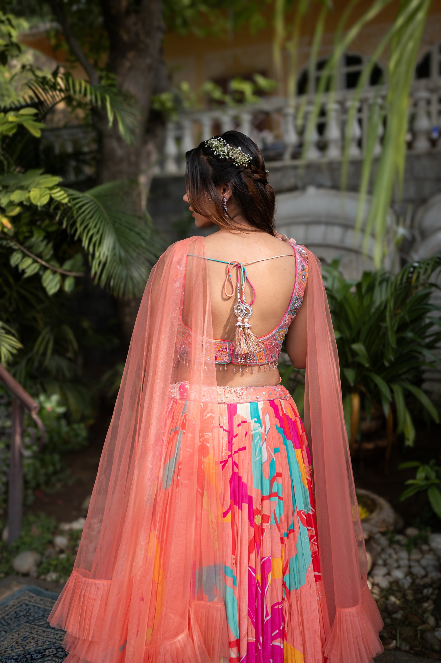 Peach Aura Crepe Silk Lehenga Set With Hand-Embroidered Crop Top