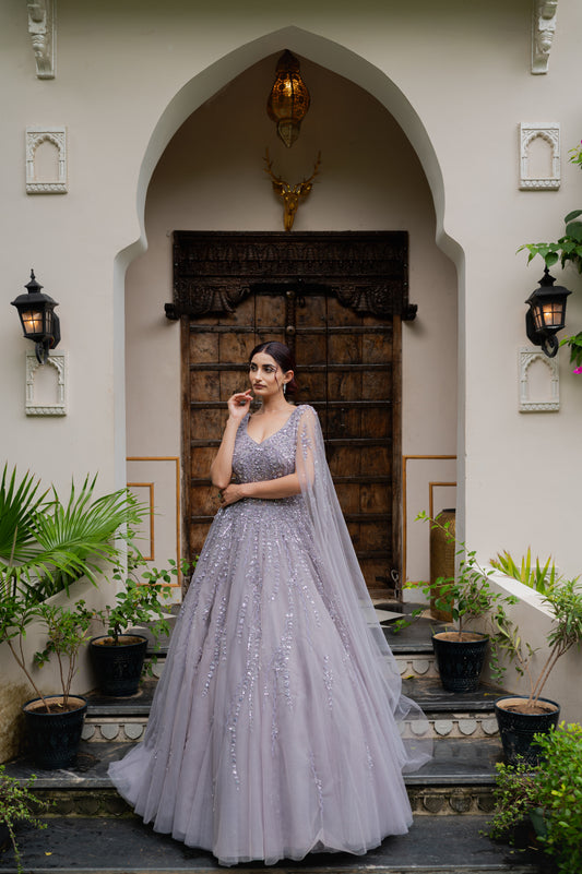 A stunning light pinkish purple soft net indo western featuring kardana sequins work indo western beautifully adorned with fine craftsmanship and exquisite detailing, perfect for festive and special occasions.