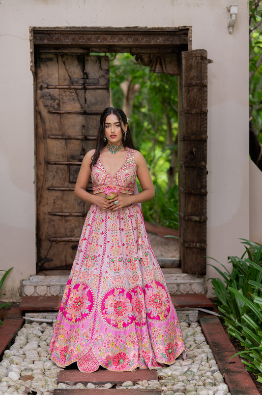 A stunning light orchid silk organza lehenga featuring handpainted and thread work lehenga beautifully adorned with fine craftsmanship and exquisite detailing, perfect for festive and special occasions.