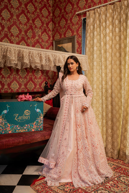 A stunning light pink net indo western featuring sequins and thread work indo western beautifully adorned with fine craftsmanship and exquisite detailing, perfect for festive and special occasions.
