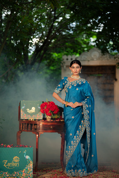 A stunning venice blue pure silk saree featuring marodi zardozi and gota patti work saree beautifully adorned with fine craftsmanship and exquisite detailing, perfect for festive and special occasions.