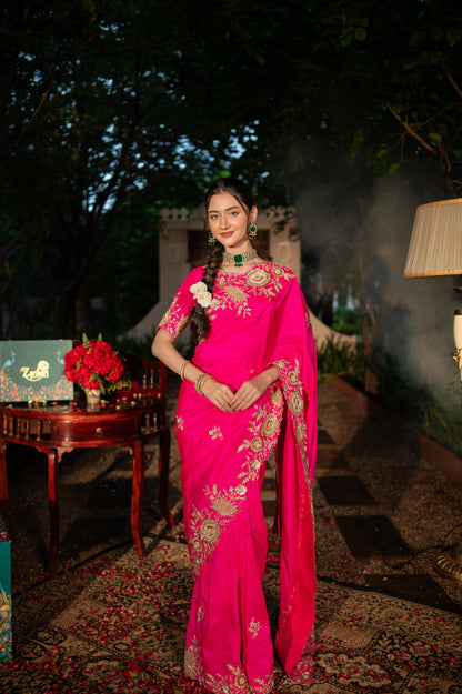A stunning hot rani raw silk saree featuring dabka marodi and zardozi work saree beautifully adorned with fine craftsmanship and exquisite detailing, perfect for festive and special occasions.