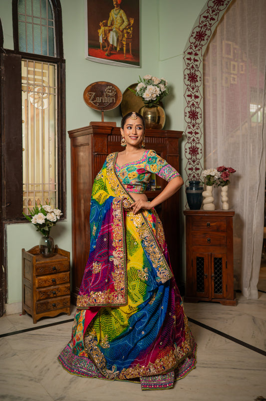 A stunning pink yellow sky blue multi pure ojariya bandhej chunari featuring zardozi double swan gota patti work chunari beautifully adorned with fine craftsmanship and exquisite detailing, perfect for festive and special occasions.