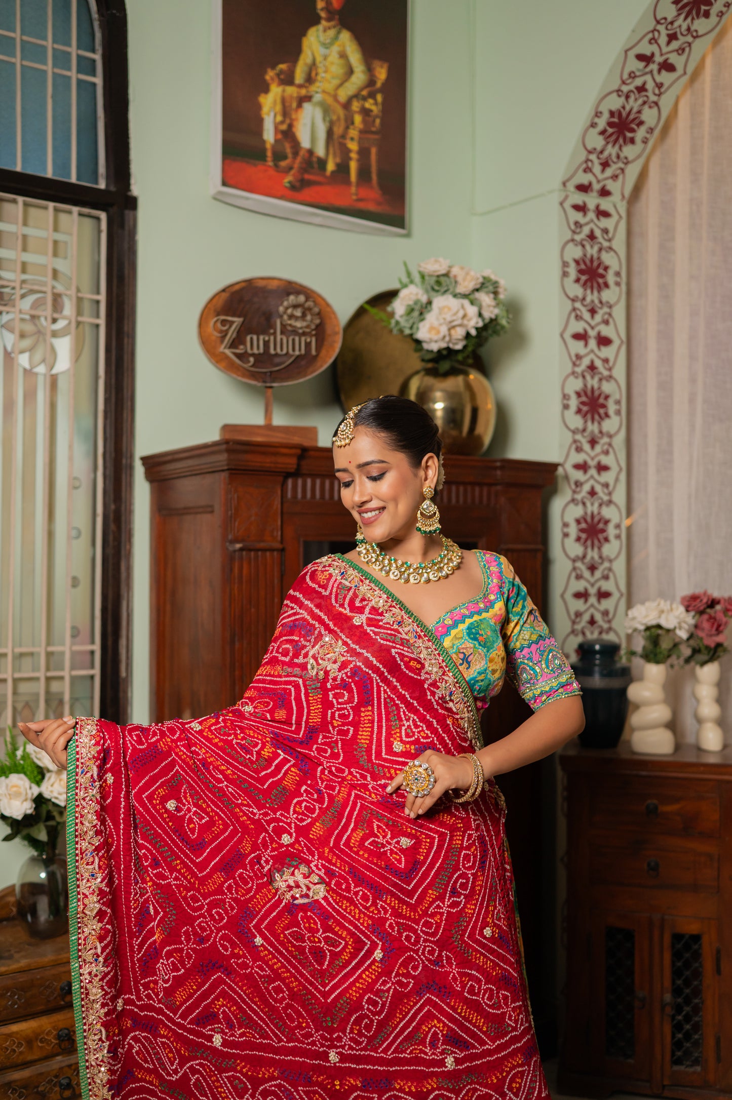A stunning red pure ojariya bandhej chunari featuring marodi zardozi peacock motifs sequins work chunari beautifully adorned with fine craftsmanship and exquisite detailing, perfect for festive and special occasions.