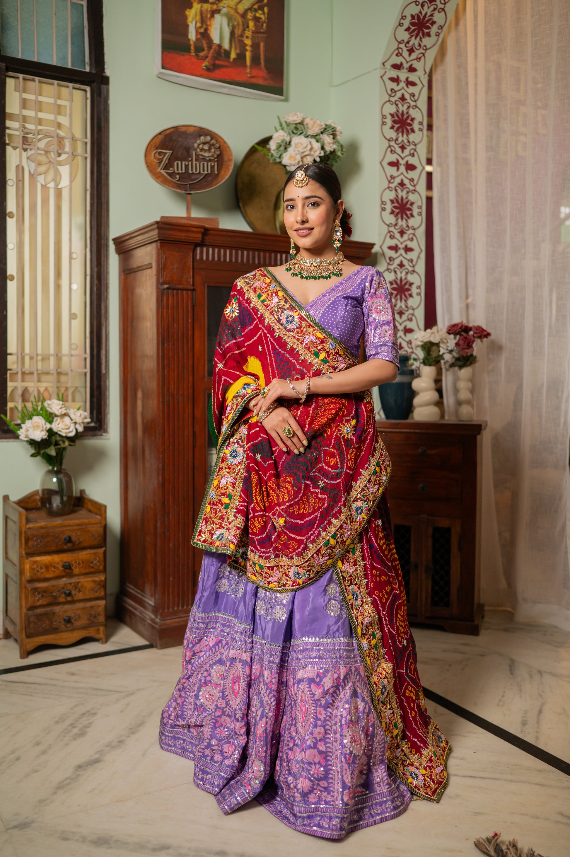 A stunning red pure ojariya bandhej chunari featuring zardozi gota patti sequins moti work chunari beautifully adorned with fine craftsmanship and exquisite detailing, perfect for festive and special occasions.