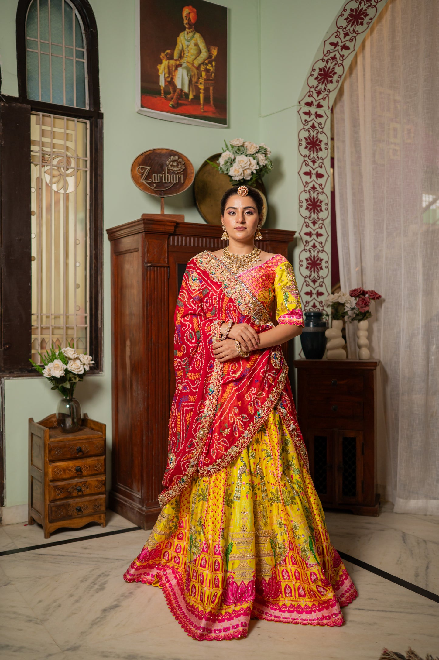 A stunning red pure ojariya bandhej chunari featuring zardozi thread elephant peacock motifs sequins work chunari beautifully adorned with fine craftsmanship and exquisite detailing, perfect for festive and special occasions.