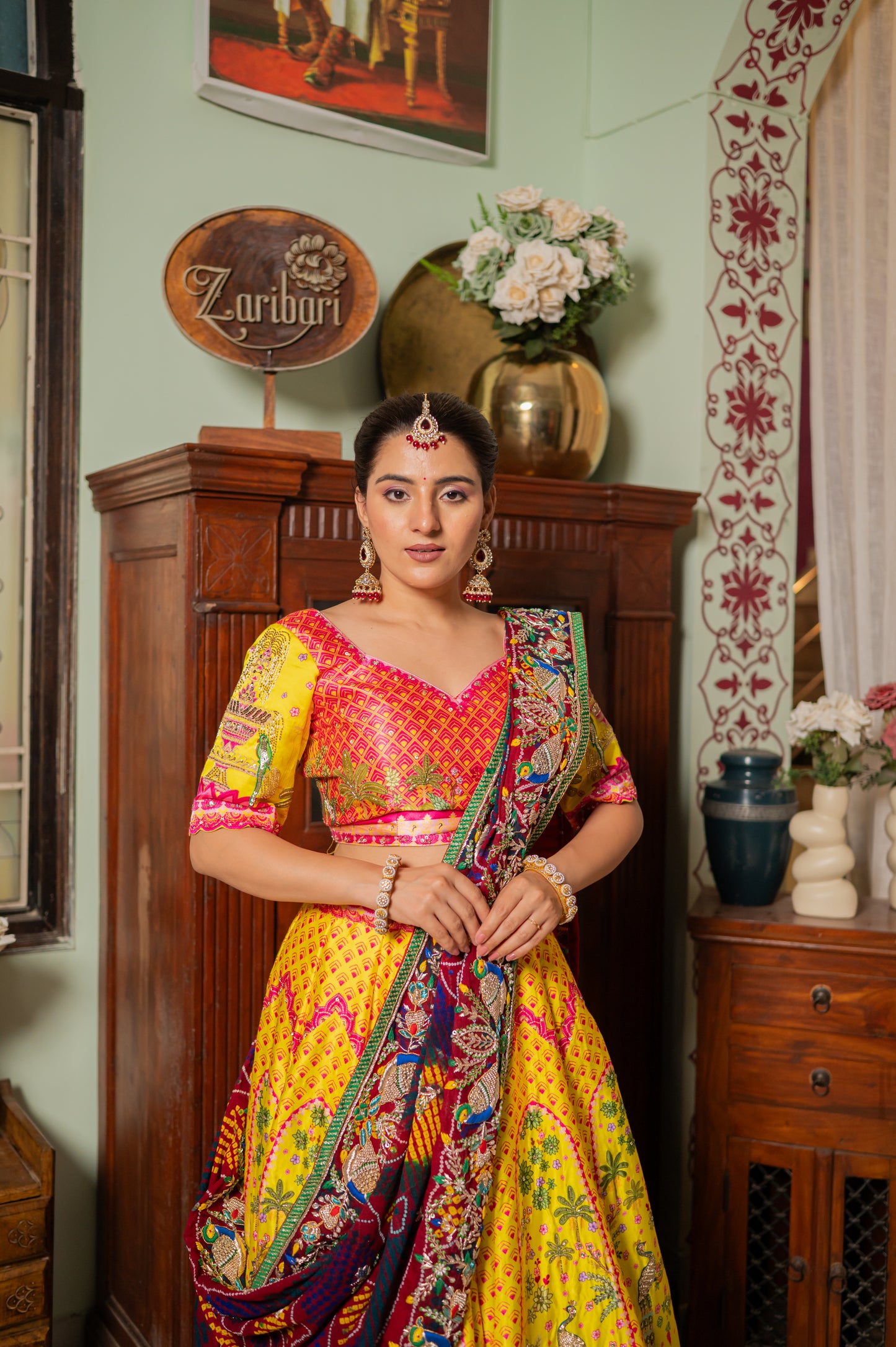 A stunning red pure ojariya bandhej chunari featuring zardozi bird motifs thread sequins work chunari beautifully adorned with fine craftsmanship and exquisite detailing, perfect for festive and special occasions.