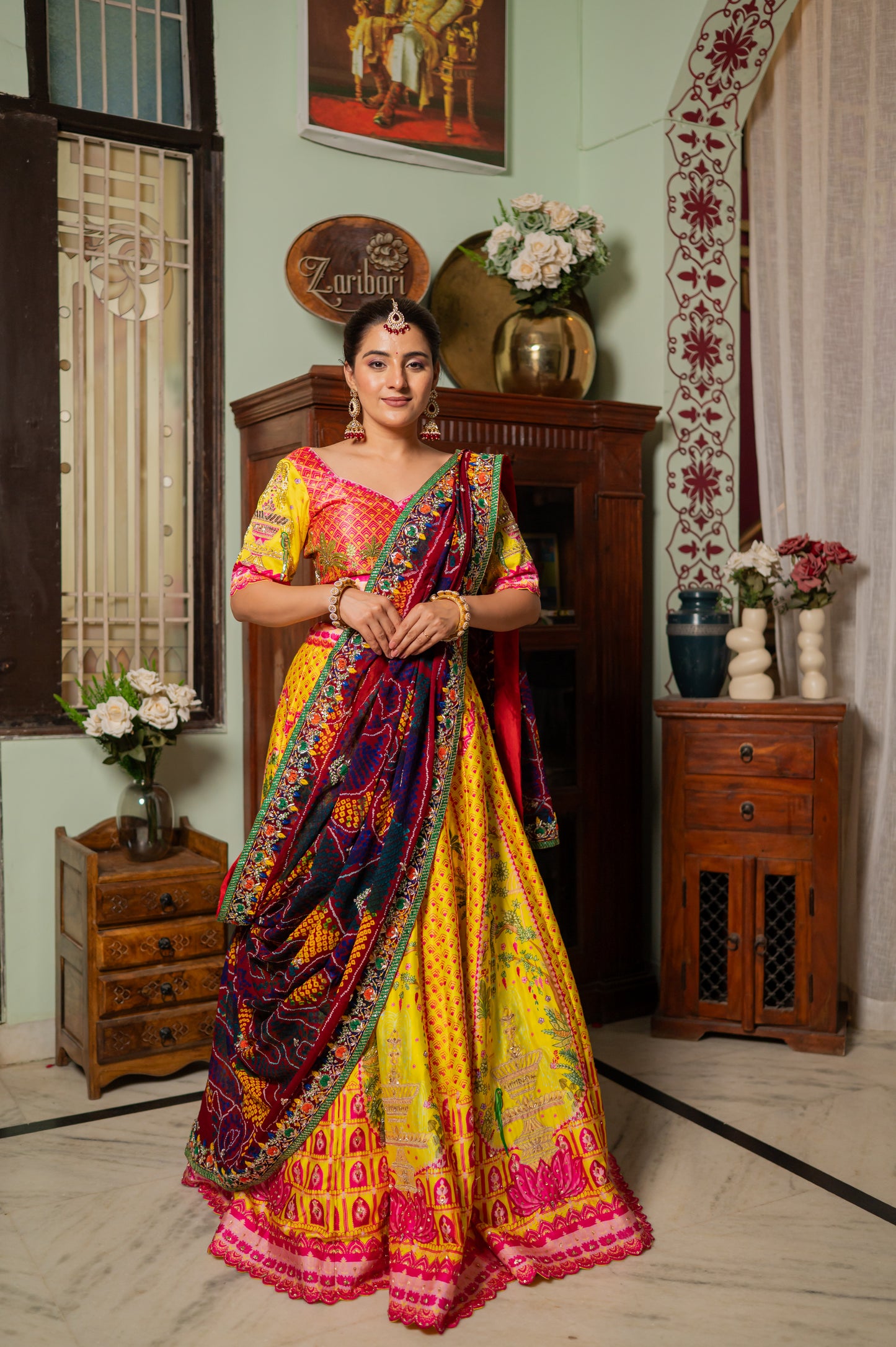 A stunning red pure ojariya bandhej chunari featuring zardozi thread pearl and sequins work chunari beautifully adorned with fine craftsmanship and exquisite detailing, perfect for festive and special occasions.