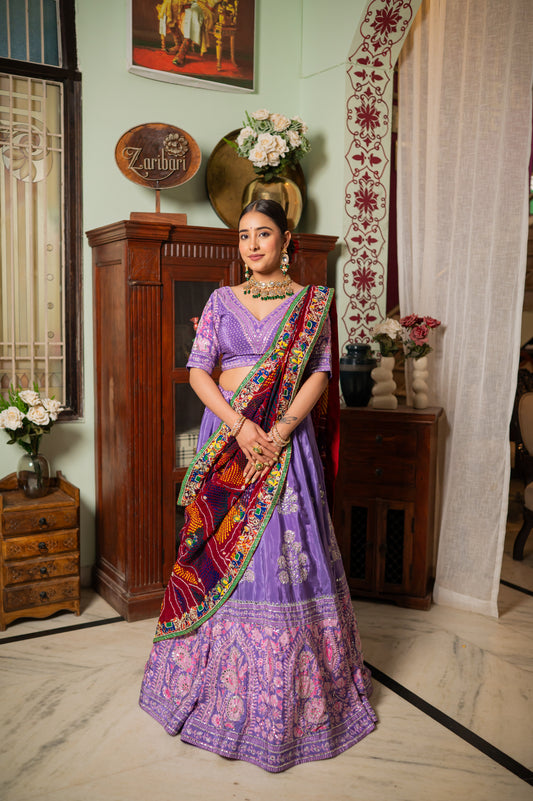 A stunning red pure ojariya bandhej chunari featuring zardozi thread elephant and peacock motifs sequins work chunari beautifully adorned with fine craftsmanship and exquisite detailing, perfect for festive and special occasions.