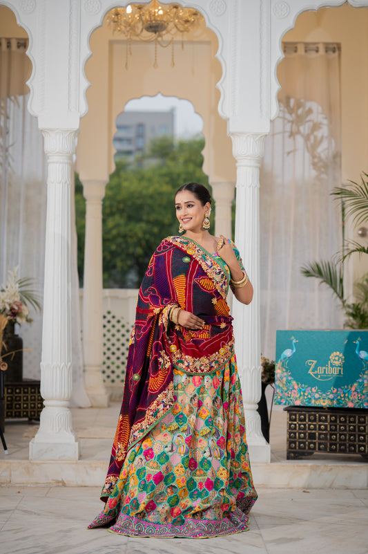 A stunning maroon pure ojariya bandhej chunari featuring marodi gota patti thread peacock motifs sequins work chunari beautifully adorned with fine craftsmanship and exquisite detailing, perfect for festive and special occasions.
