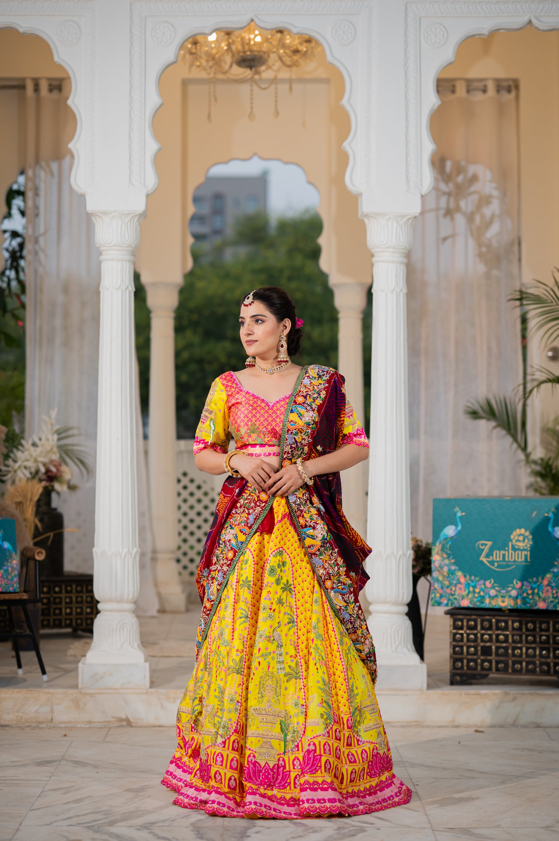 A stunning maroon pure ojariya bandhej chunari featuring marodi zardozi thread radha krishna motifs sequins work chunari beautifully adorned with fine craftsmanship and exquisite detailing, perfect for festive and special occasions.