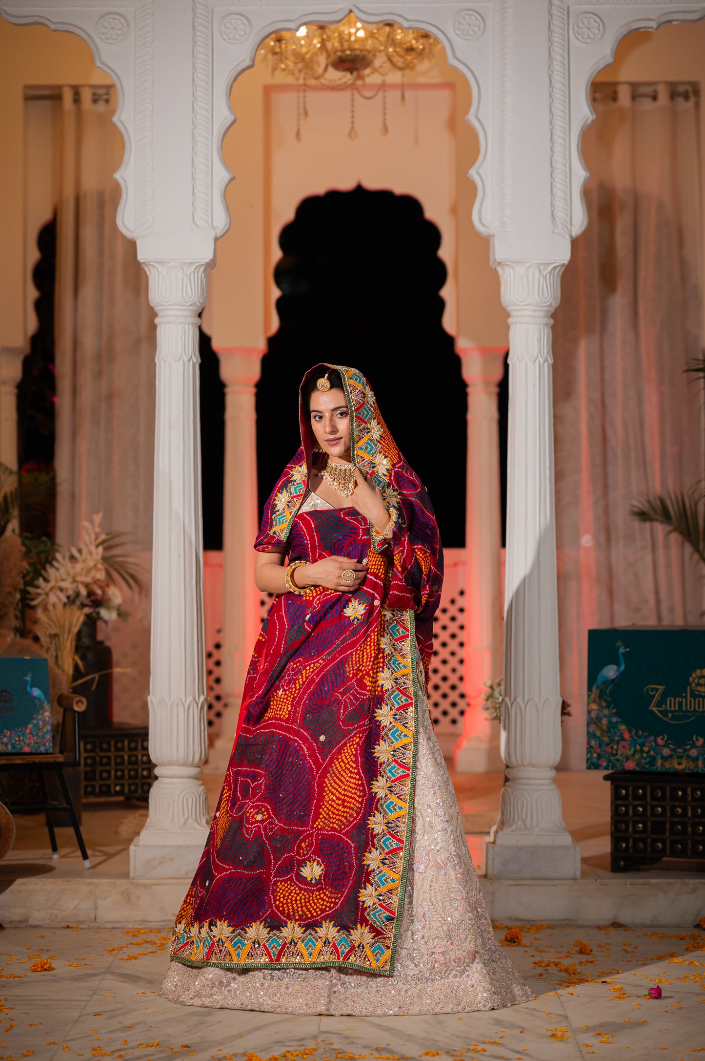 A stunning maroon pure ojariya bandhej chunari featuring zardozi thread motifs gota patti sequins kardana work chunari beautifully adorned with fine craftsmanship and exquisite detailing, perfect for festive and special occasions.