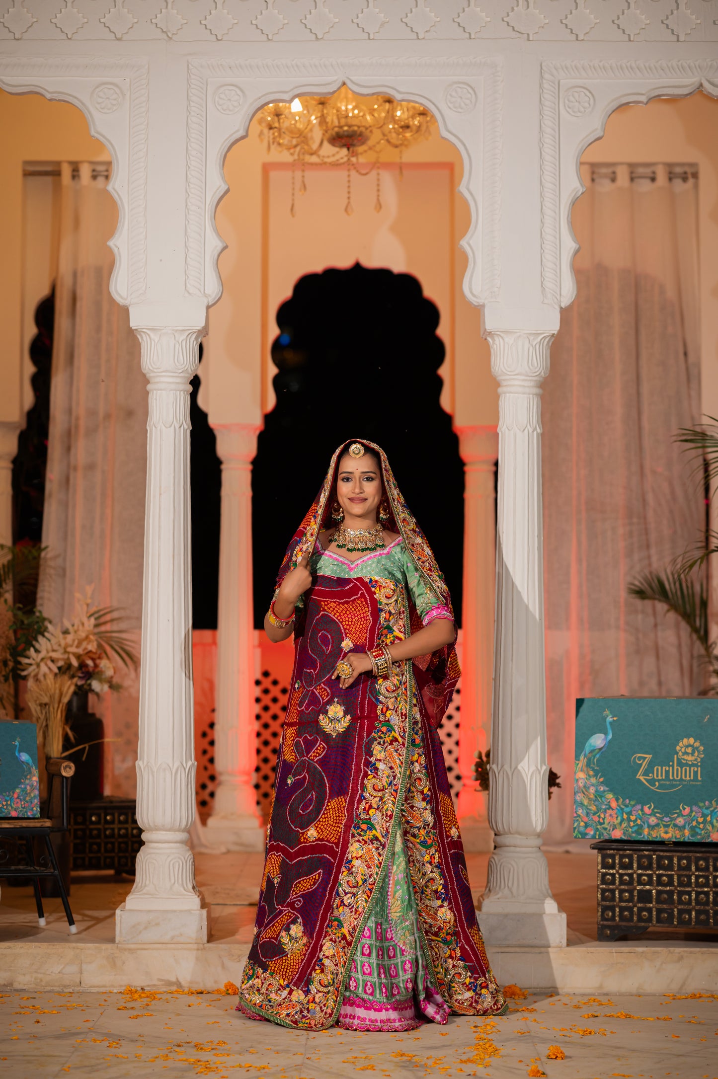 A stunning maroon pure ojariya bandhej chunari featuring marodi zardozi and thread birds motifs sequins work chunari beautifully adorned with fine craftsmanship and exquisite detailing, perfect for festive and special occasions.