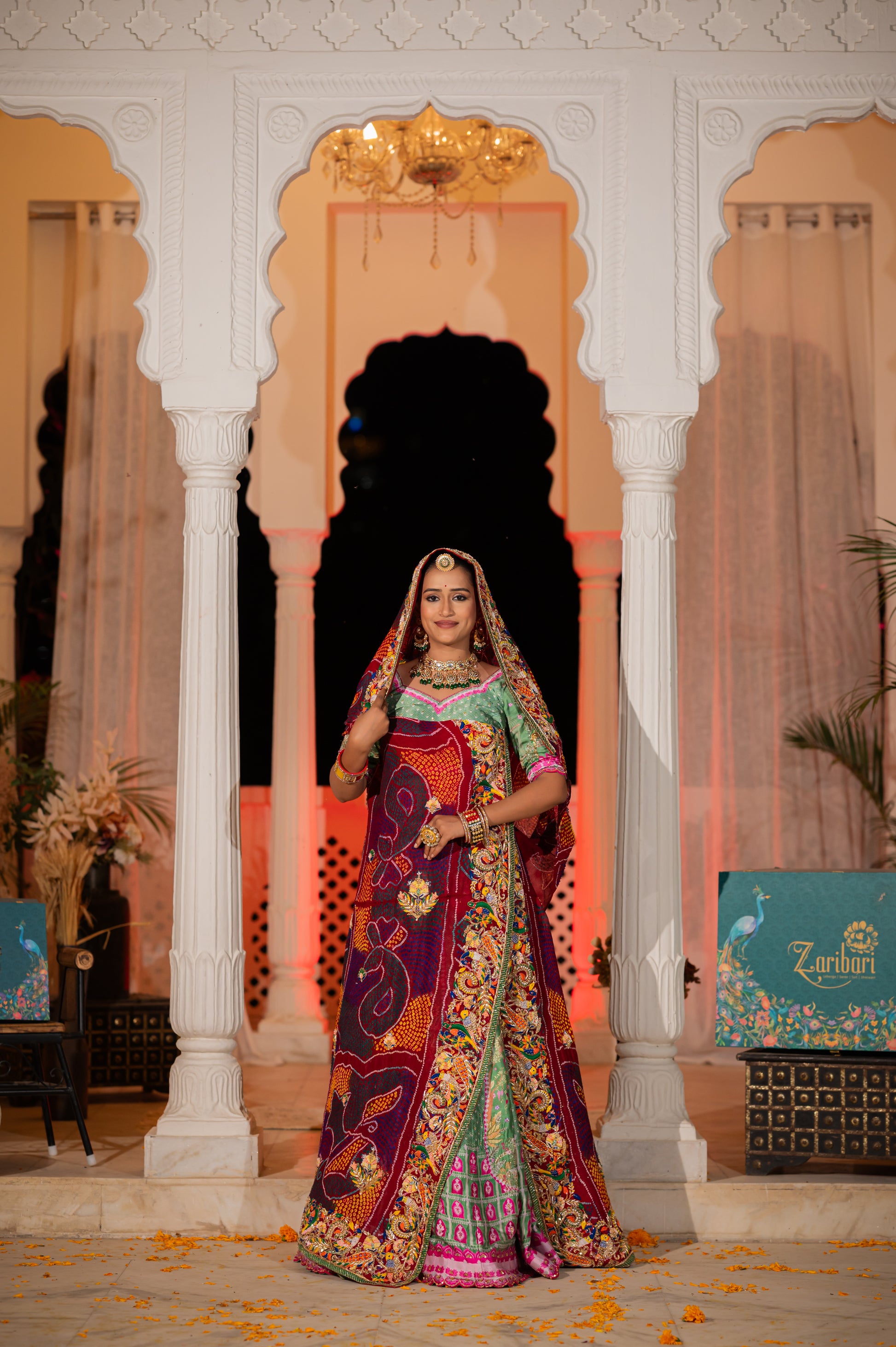 A stunning maroon pure ojariya bandhej chunari featuring marodi zardozi and thread birds motifs sequins work chunari beautifully adorned with fine craftsmanship and exquisite detailing, perfect for festive and special occasions.