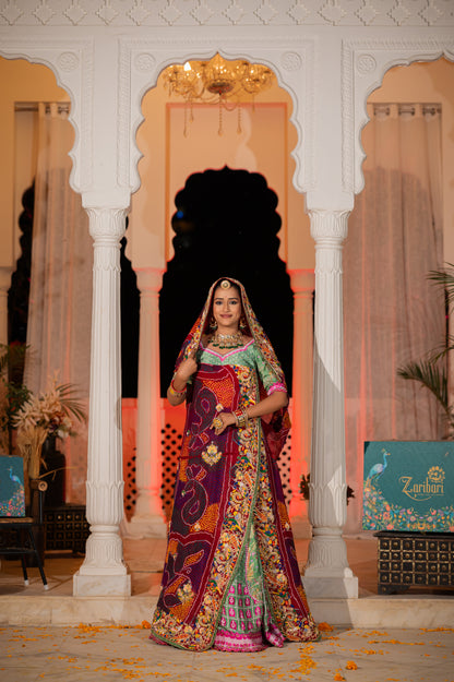 A stunning maroon pure ojariya bandhej chunari featuring marodi zardozi and thread birds motifs sequins work chunari beautifully adorned with fine craftsmanship and exquisite detailing, perfect for festive and special occasions.