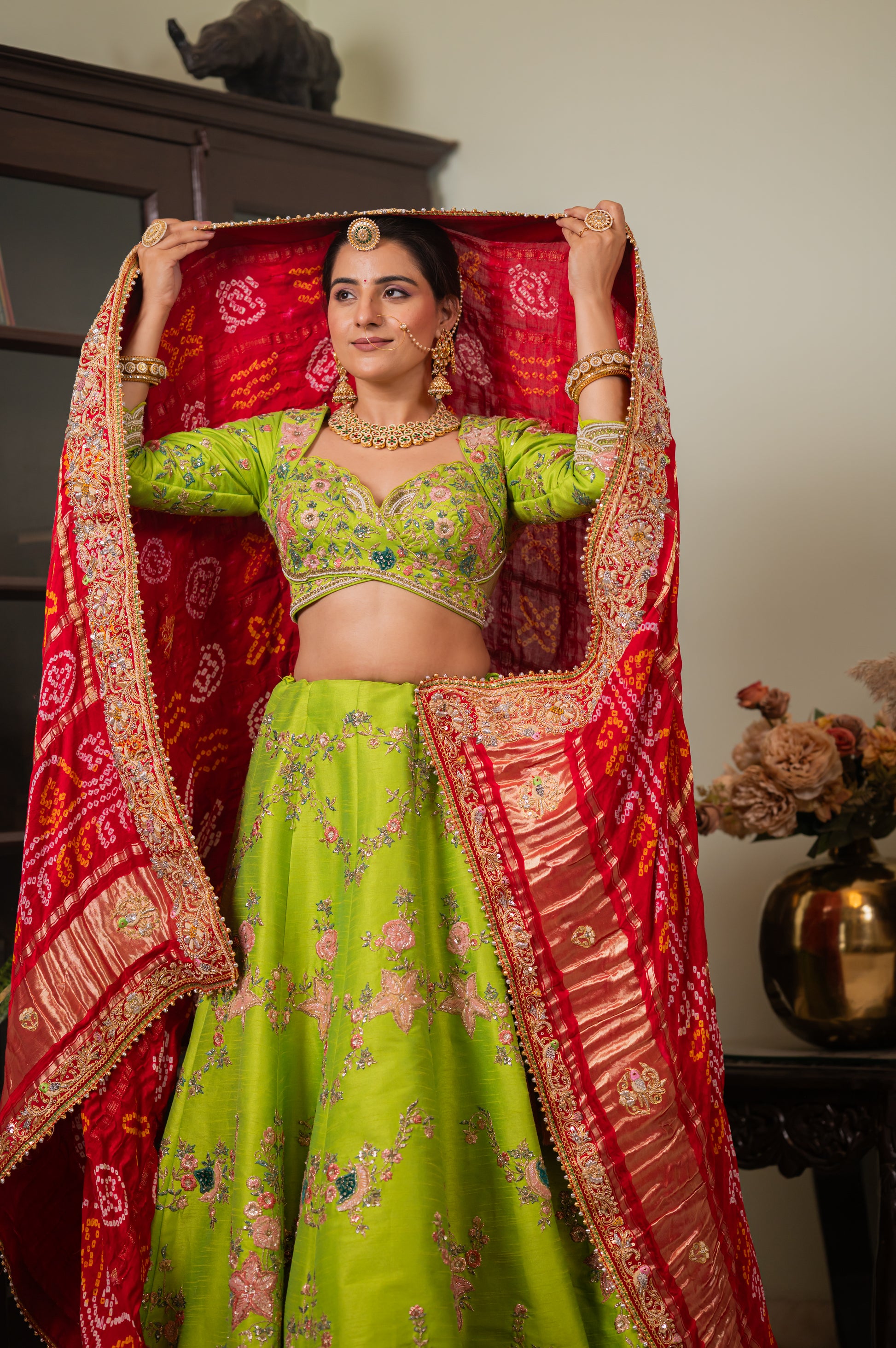 A stunning red gajji silk ghatchola bandhej chunari featuring marodi zardozi bird motifs sequins work chunari beautifully adorned with fine craftsmanship and exquisite detailing, perfect for festive and special occasions.