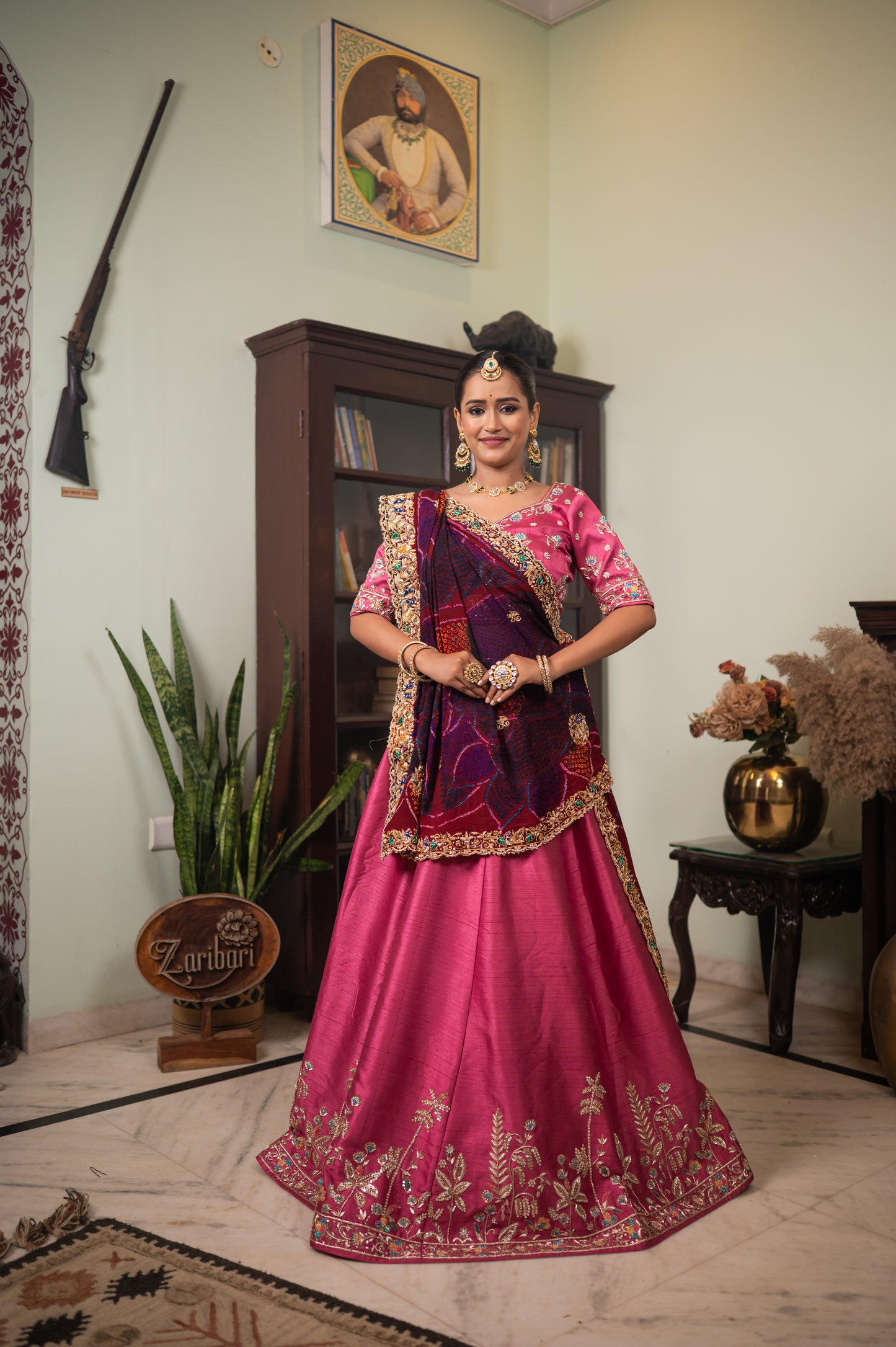 A stunning maroon pure ojariya bandhej chunari featuring zarodozi double peacock motifs sequins work chunari beautifully adorned with fine craftsmanship and exquisite detailing, perfect for festive and special occasions.