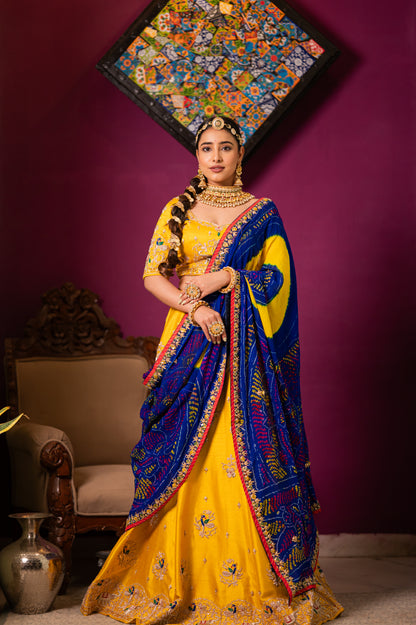 A stunning blue pure ojariya bandhej chunari featuring aari zardozi sequins work chunari beautifully adorned with fine craftsmanship and exquisite detailing, perfect for festive and special occasions.